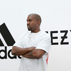 Kanye West in front of adidas Yeezy backtround