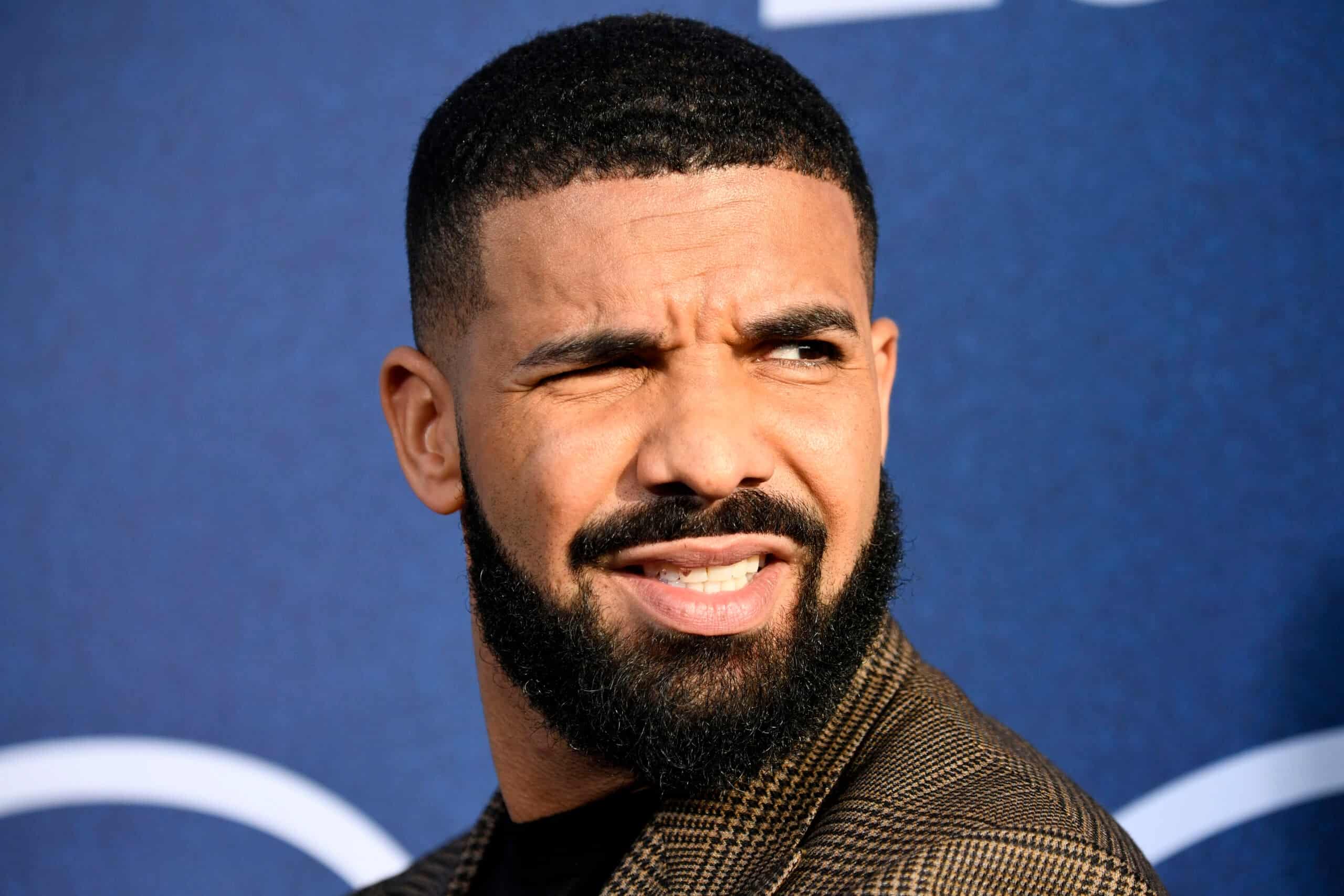 Artist Responsible For Drake’s Dad’s Drizzy Portrait Tattoo Slams The Rapper 