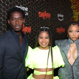 LOS ANGELES, CALIFORNIA - MARCH 14: (L-R) Damson Idris, Dominique Fishback, and Chloe Bailey attend the "Swarm" Red Carpet Premiere and Screening in Los Angeles at Lighthouse Artspace LA on March 14, 2023 in Los Angeles, California.