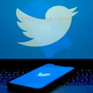 KNUTSFORD, UNITED KINGDOM APRIL 21: In this photo illustration the Twitter logo is seen on a computer screen and mobile cellphone on April 21, 2023 in Knutsford, United Kingdom. The social media company started removing large numbers of the blue verification check marks, or "blue ticks," that had historically indicated a verified account. The company said in a statement that they are "removing legacy verified checkmarks" and, to remain verified on Twitter, users can sign up for the paid Twitter Blue subscription.